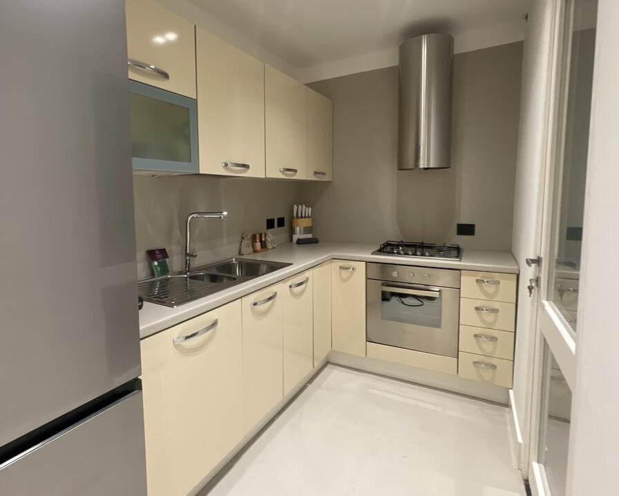 Modern CREO kitchen in Olbia townhouse with premium appliances, elegant finishes, and family-friendly layout